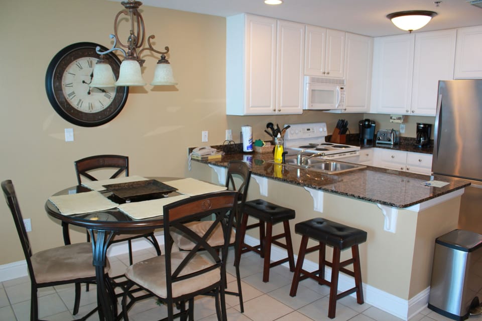 Condo, 2 Bedrooms, Balcony, Beachfront | Private kitchen | Full-size fridge, microwave, oven, stovetop