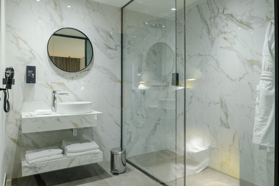 Shower, rainfall showerhead, designer toiletries, hair dryer