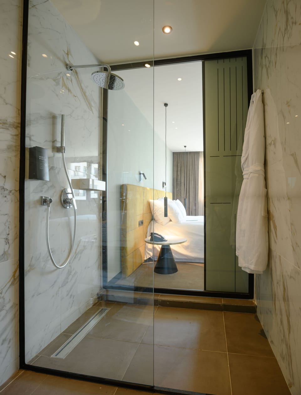 Shower, rainfall showerhead, designer toiletries, hair dryer