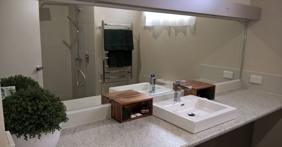 Room 26: Family Room with 50 inch Smart TV located on First Floor | Bathroom sink