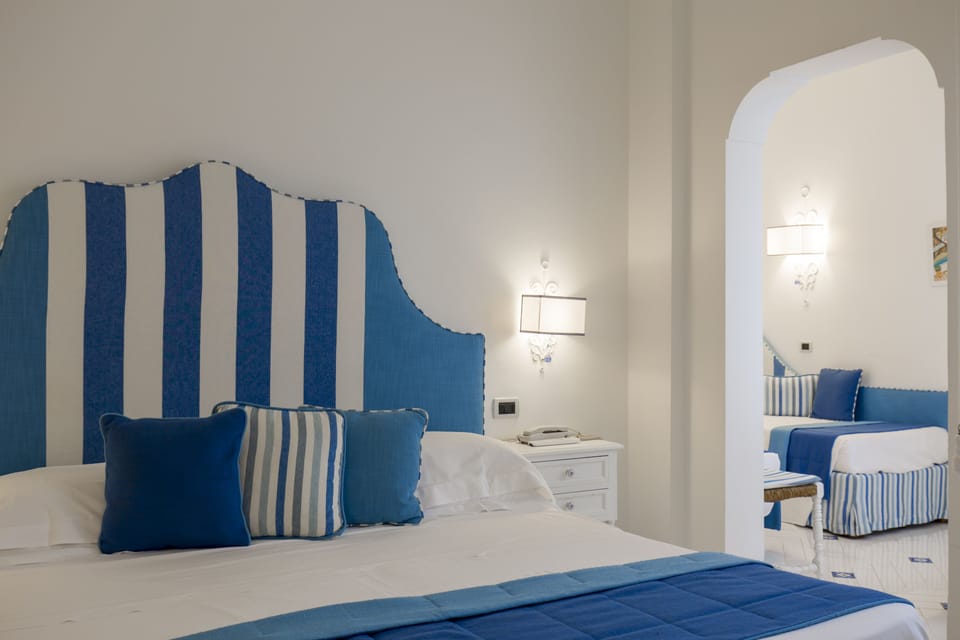 Family Room | Premium bedding, down comforters, minibar, in-room safe