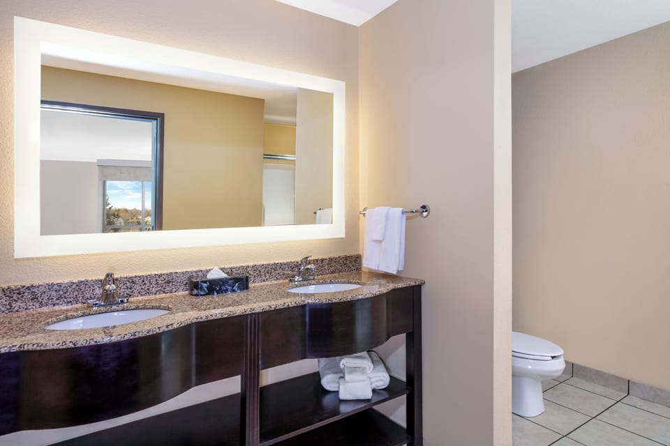 Suite, 1 King Bed with Sofa bed, Jetted Tub | Bathroom | Hair dryer, towels