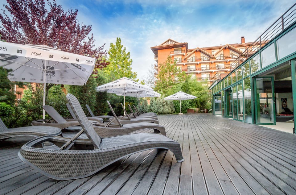 Indoor pool, pool umbrellas, sun loungers