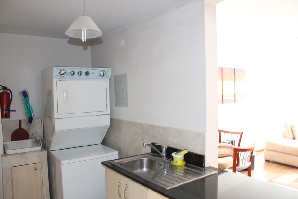 Full-size fridge, microwave, stovetop, cookware/dishes/utensils
