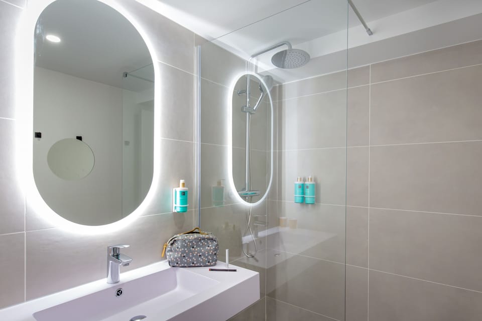 Shower, eco-friendly toiletries, hair dryer, towels