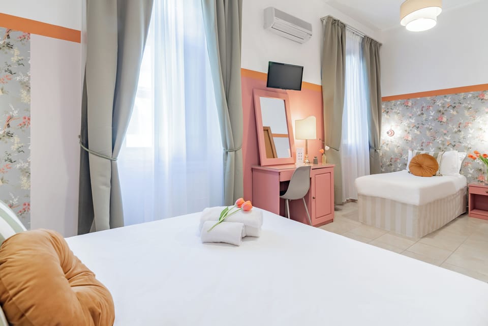 Deluxe Triple Room | Minibar, in-room safe, desk, free WiFi
