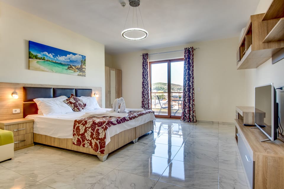 Apartment, 2 Bedrooms, Balcony | In-room safe, desk, iron/ironing board, free cribs/infant beds