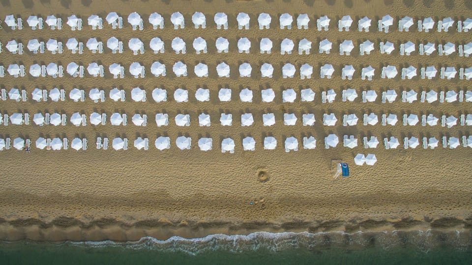 On the beach, sun loungers, beach umbrellas, beach towels