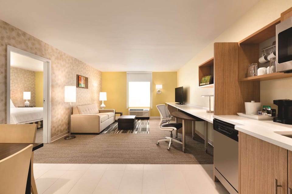Desk, laptop workspace, blackout drapes, iron/ironing board