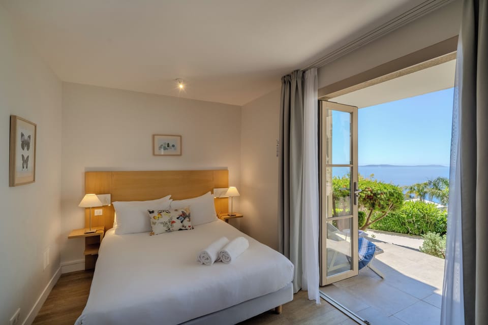 Standard Room, partial sea View, Ground Floor | Hypo-allergenic bedding, minibar, in-room safe, desk