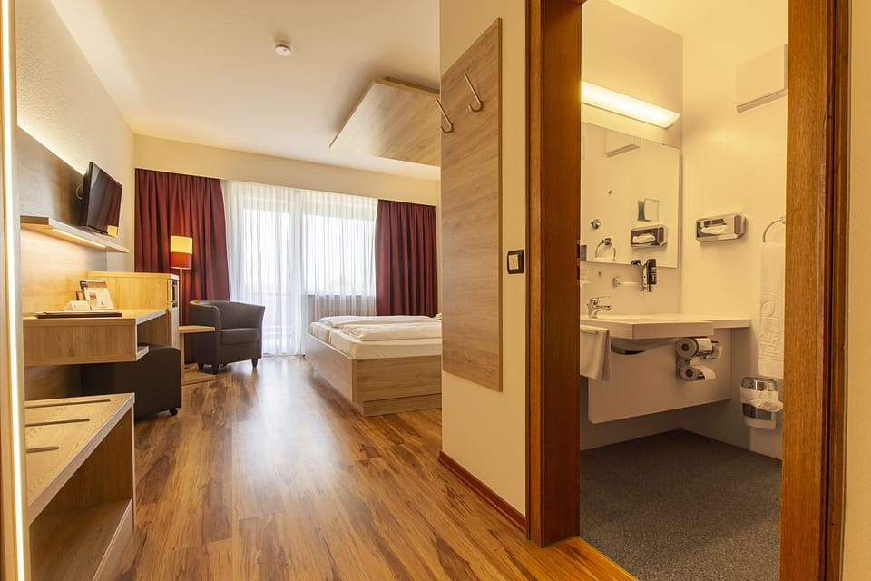 Double Room, Balcony | Living area | 82-cm LCD TV with satellite channels, TV