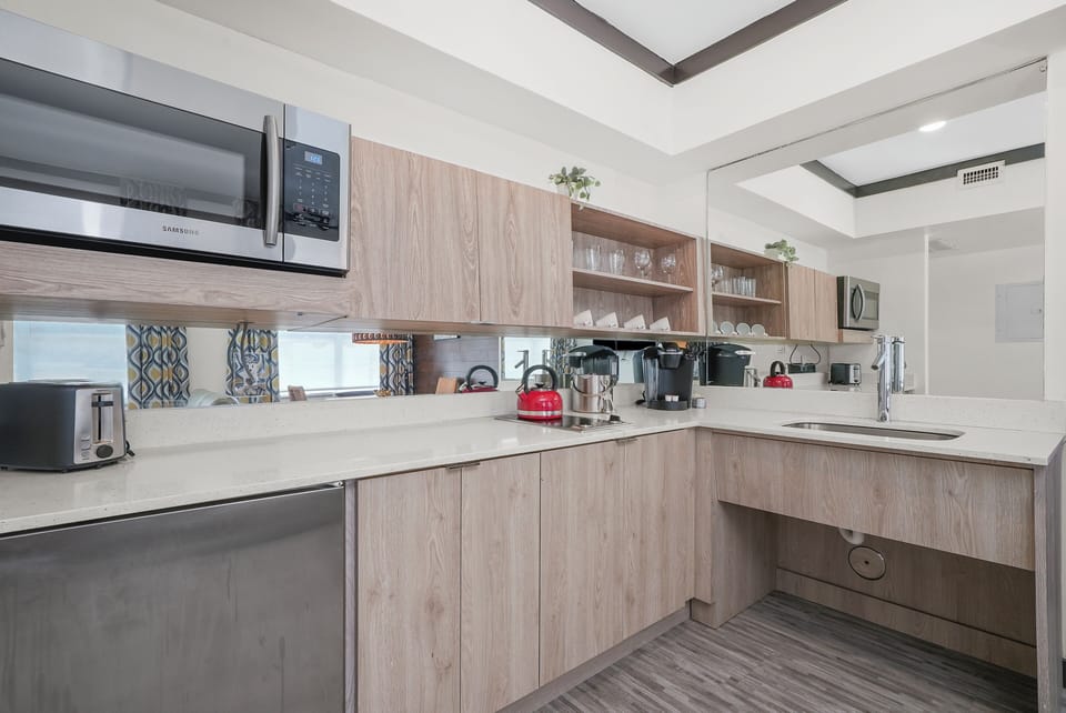 Accessible Deluxe One Bedroom Queen Suite | Private kitchen | Fridge, microwave, oven, stovetop