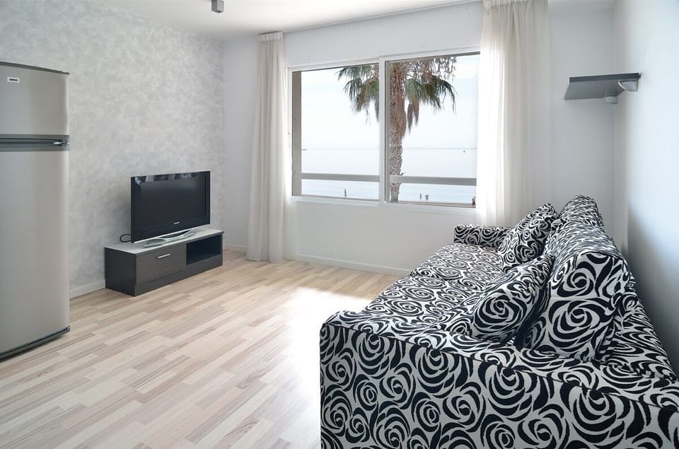 Apartment, 1 Bedroom, Sea View (Bis) | Living area | 24-inch flat-screen TV with satellite channels, TV, table tennis