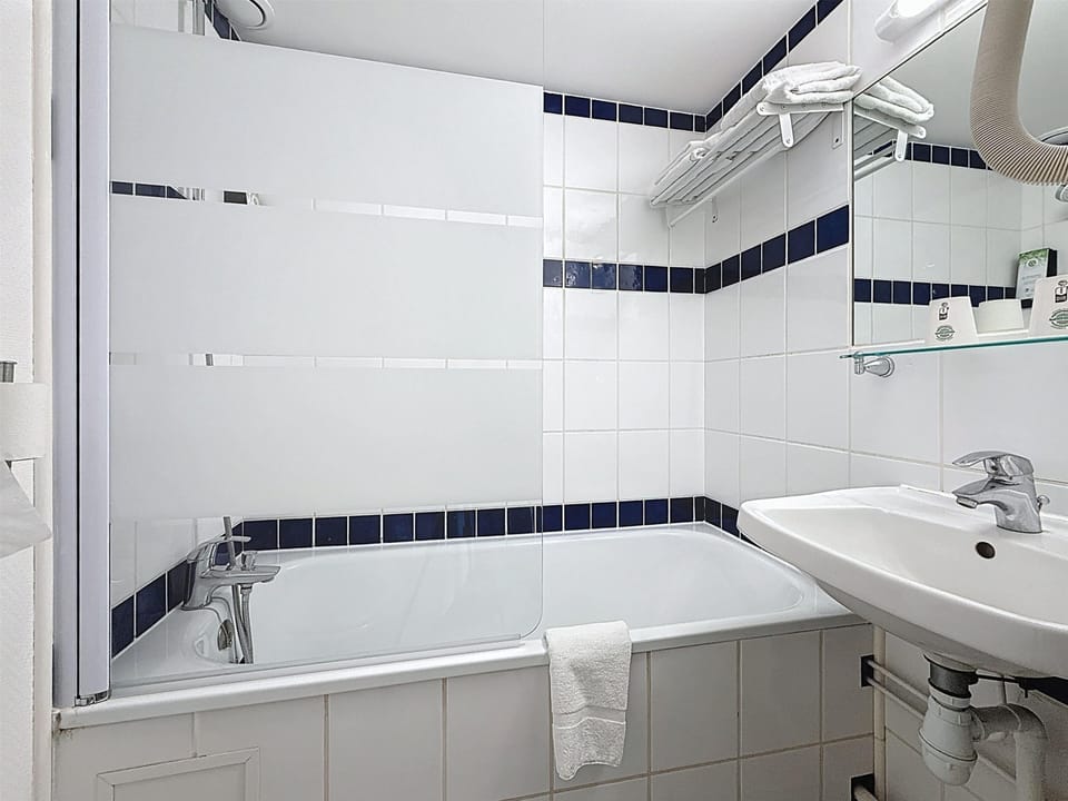 Standard Room - 2 Single Beds 1 Single Bed in mezzanine | Bathroom | Eco-friendly toiletries, hair dryer, towels