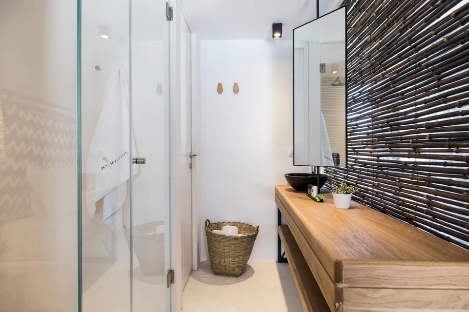 Shower, designer toiletries, hair dryer, bathrobes