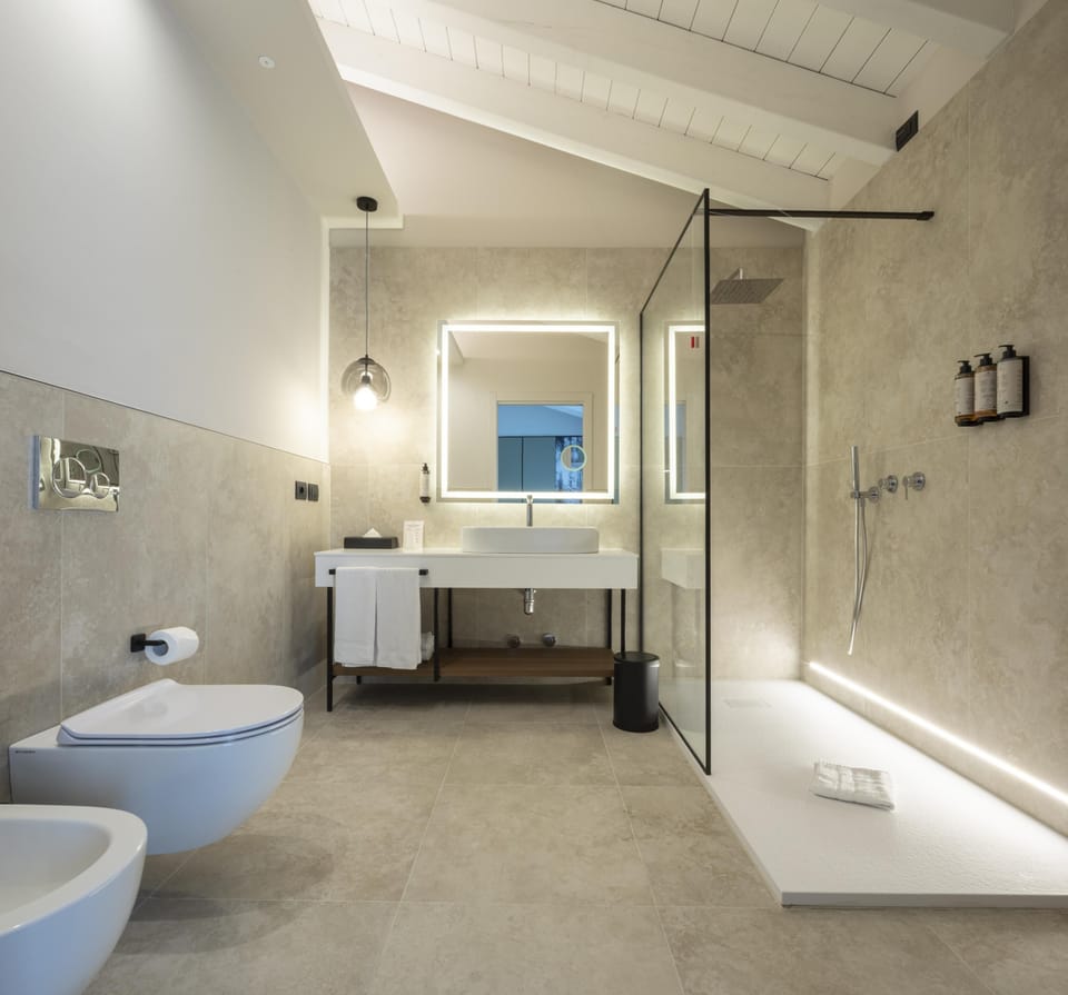 Junior Suite, 1 Queen Bed, Non Smoking, Balcony (with Sofabed) | Bathroom | Hair dryer, bidet, towels, soap