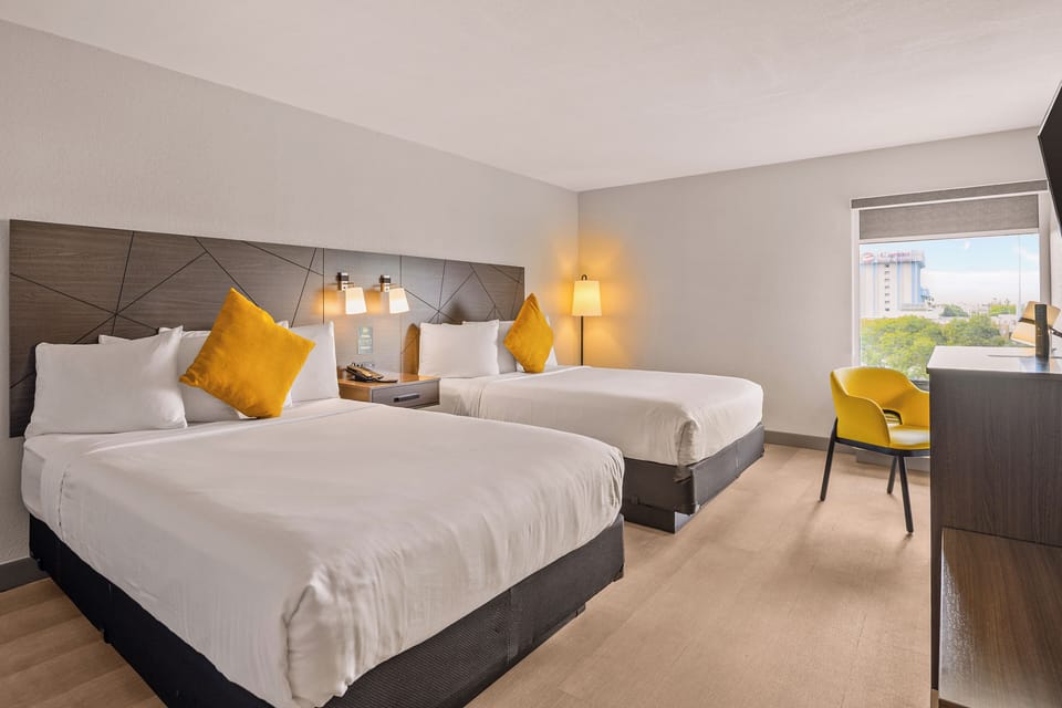 Standard Room, 2 Queen Beds, Non Smoking | In-room safe, desk, laptop workspace, soundproofing