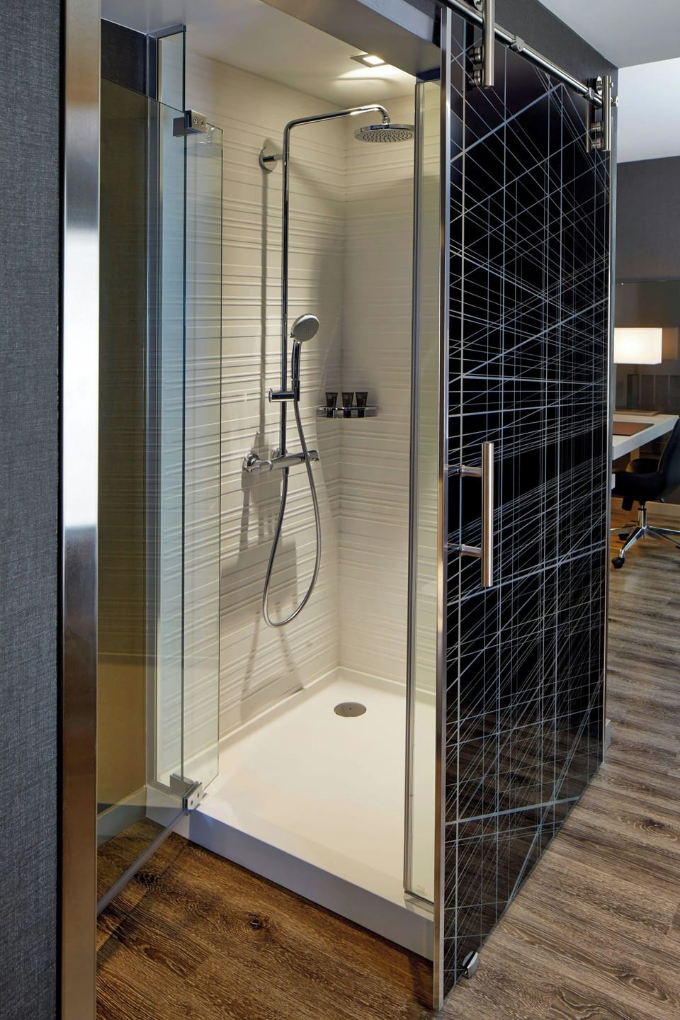 Shower, designer toiletries, hair dryer, towels