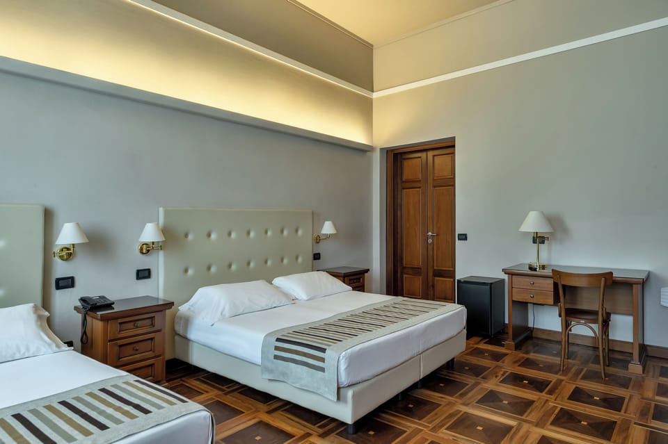 Triple Room, 1 Bedroom | In-room safe, desk, cribs/infant beds, rollaway beds