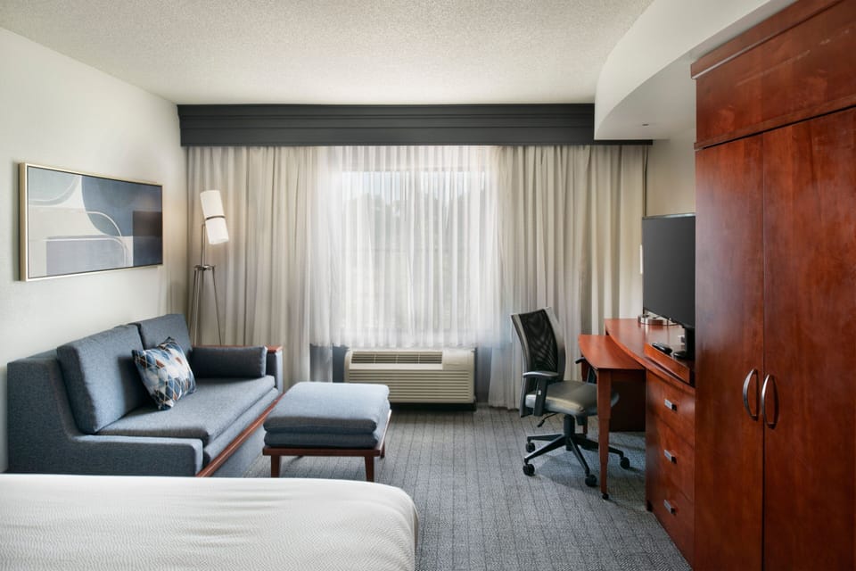 Premium bedding, desk, blackout drapes, iron/ironing board