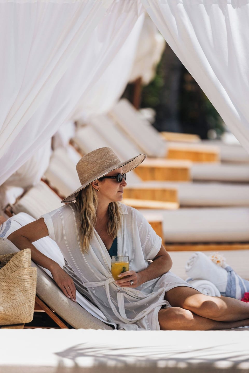On the beach, white sand, sun loungers, beach umbrellas