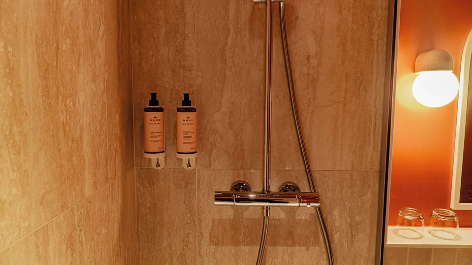 Bathtub, hair dryer, towels, soap
