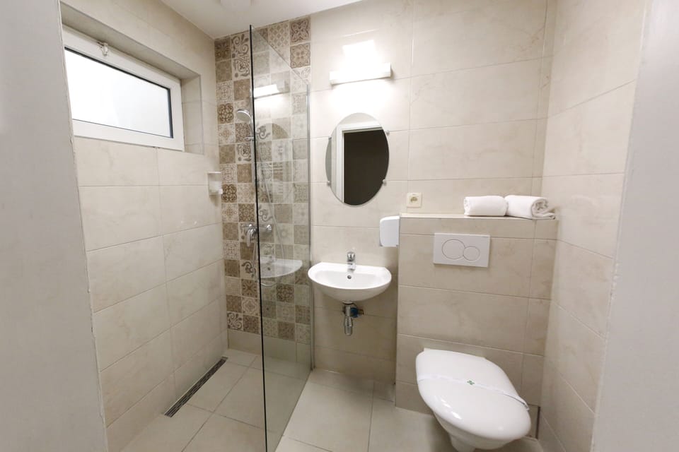 Standard Double Room | Bathroom | Shower, hair dryer, towels