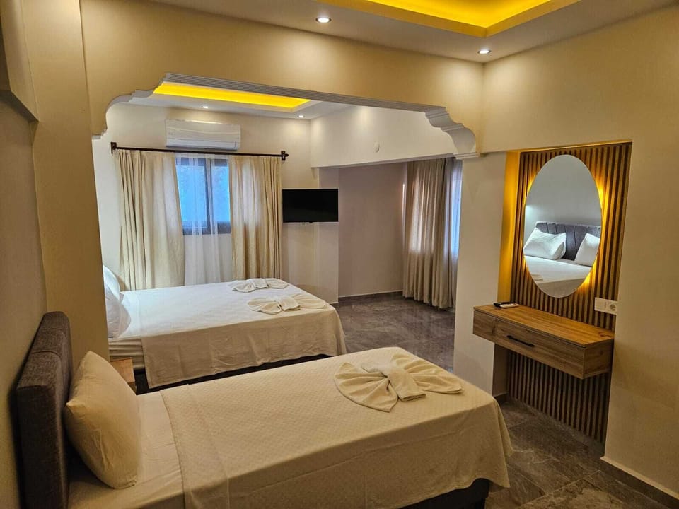 Triple Room | Minibar, desk, iron/ironing board (on request), cribs (free)