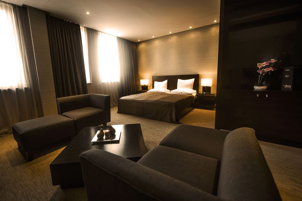 Premium Room, Hot Tub | Living area | Flat-screen TV