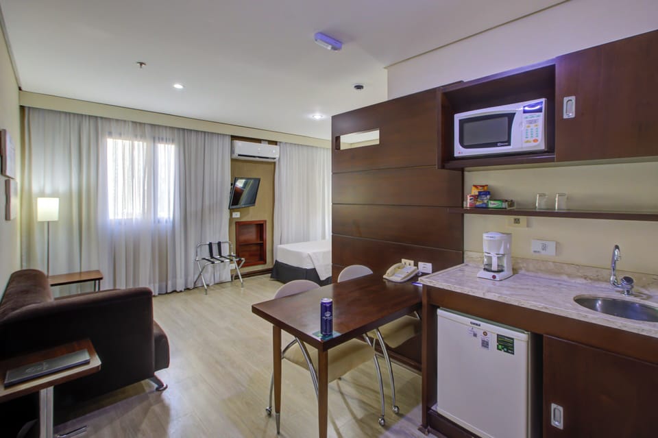 Standard Twin Room | Living area | 32-inch LED TV with cable channels, TV