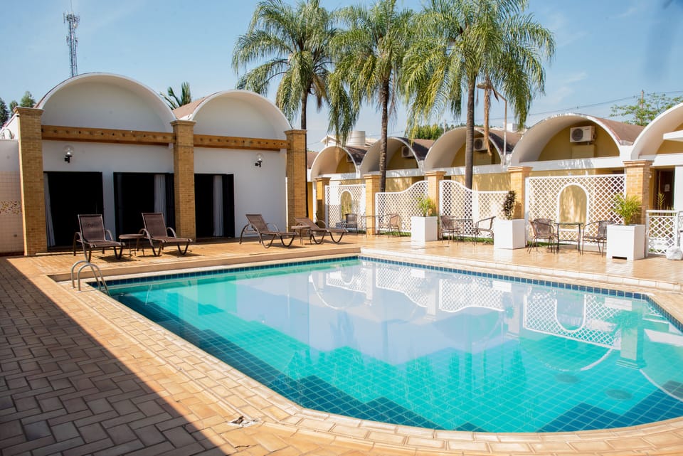 Outdoor pool, pool umbrellas, sun loungers
