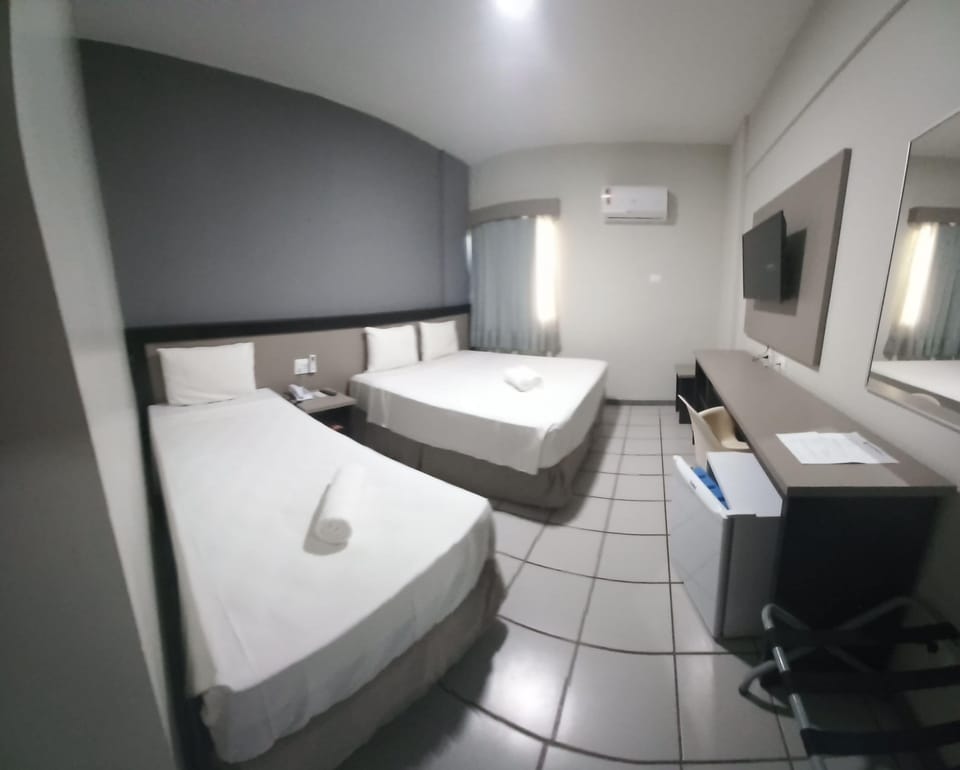 Economy Triple Room | In-room safe, desk, blackout drapes, free cribs/infant beds