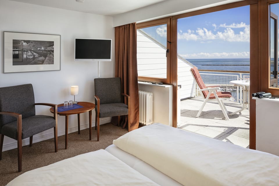 Deluxe Double Room, Balcony, Sea View | Living area | 45-inch flat-screen TV with satellite channels, TV
