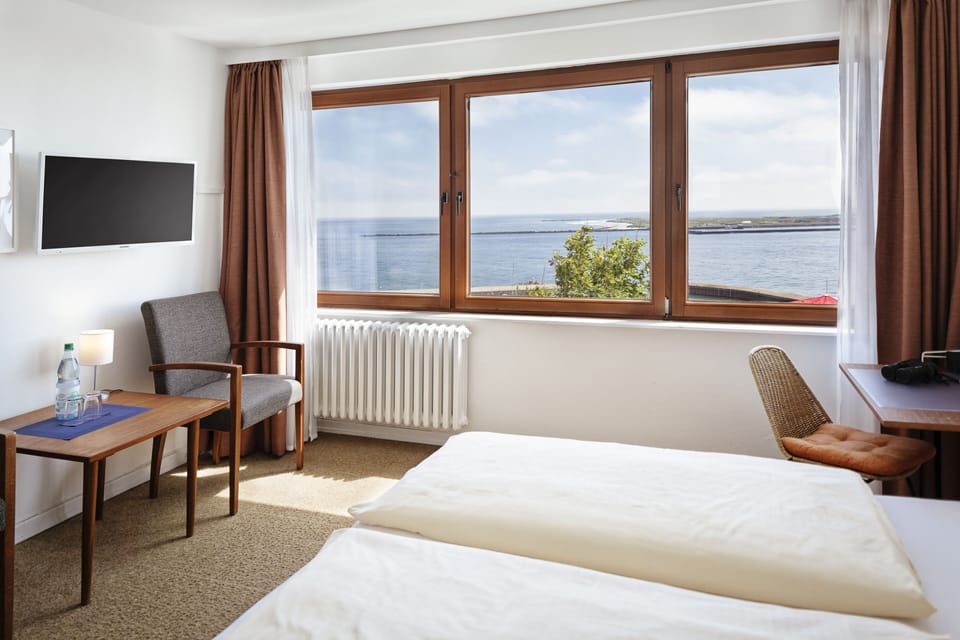 Double Room, Sea View | Living area | 45-inch flat-screen TV with satellite channels, TV