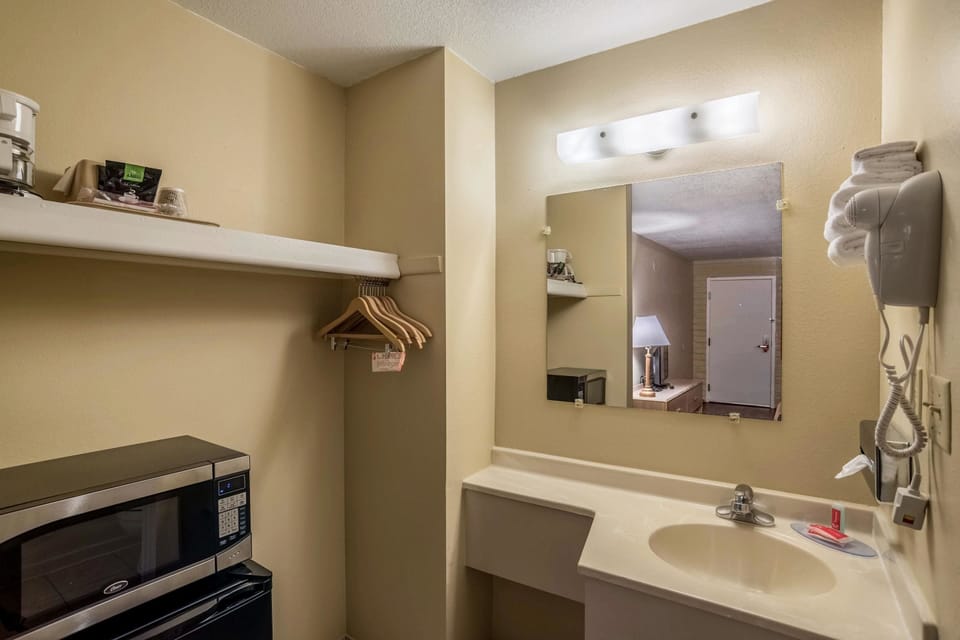 Standard Room, 2 Queen Beds, Non Smoking | Bathroom | Combined shower/tub, hair dryer, towels