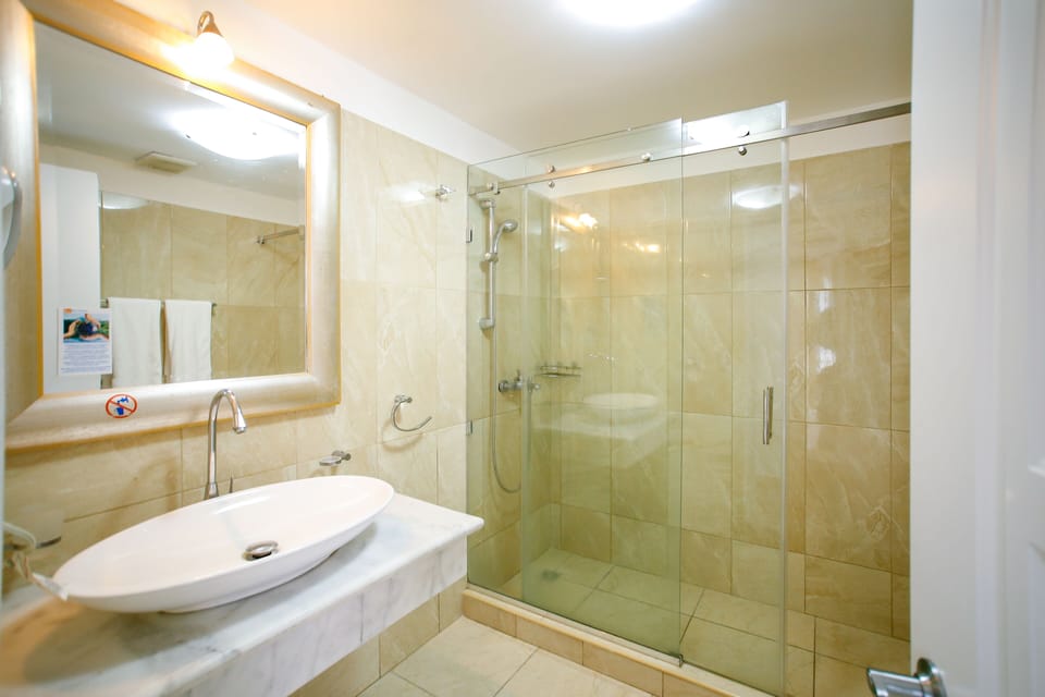 Apartment, 2 Bedrooms | Bathroom | Shower, free toiletries, hair dryer, towels
