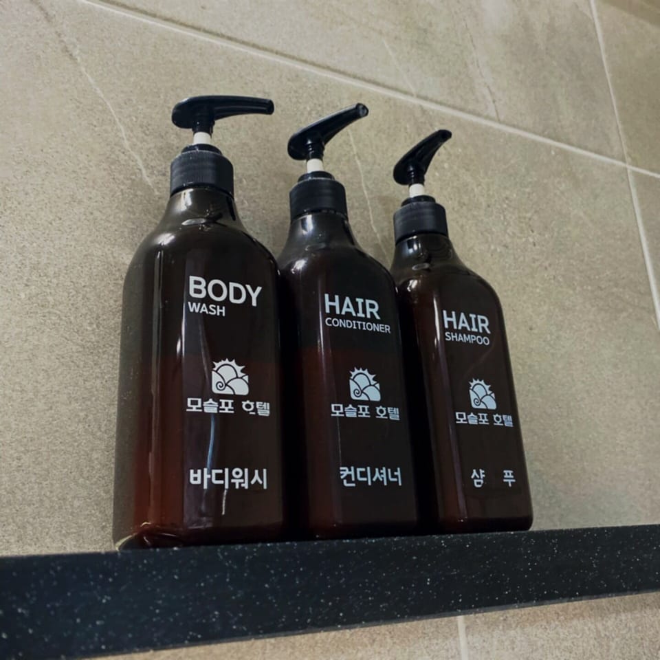 Shower, hair dryer, slippers, towels