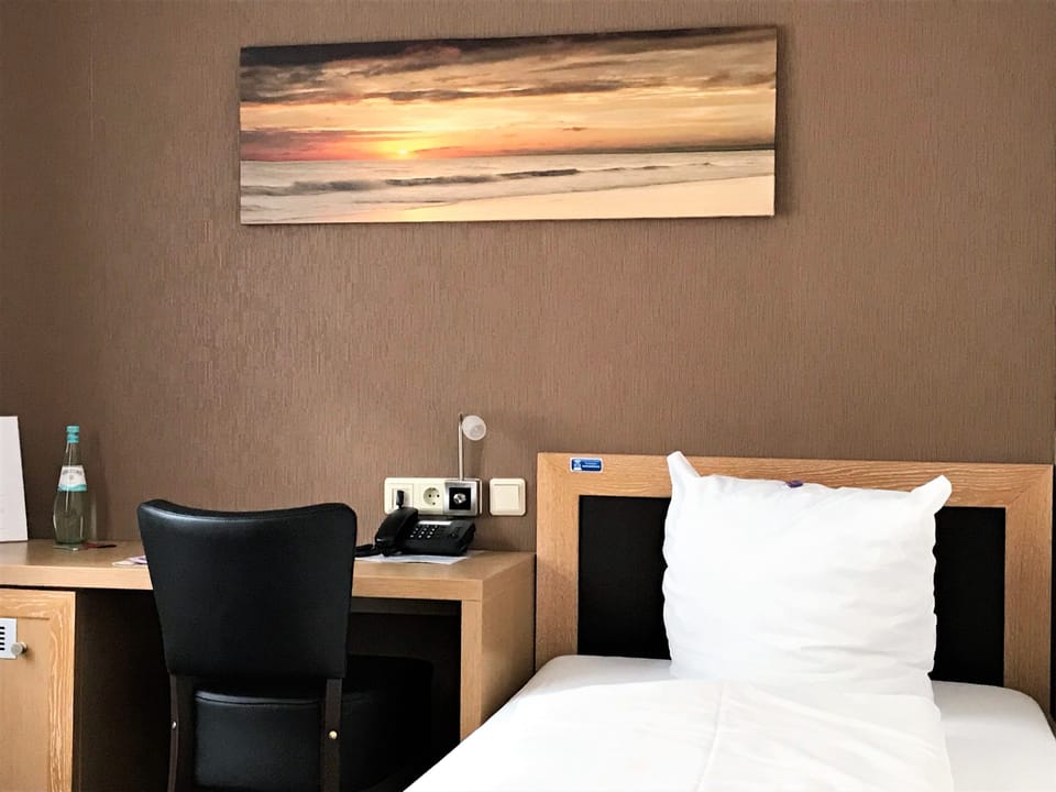Premium bedding, desk, laptop workspace, free WiFi