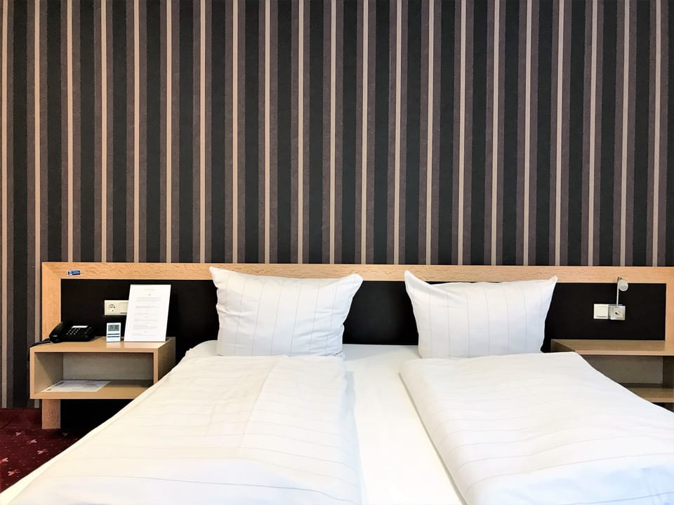 Premium bedding, desk, laptop workspace, free WiFi