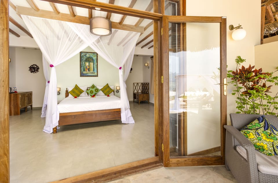 Beachfront Bungalow with Plunge Pool | Minibar, in-room safe, desk, blackout drapes