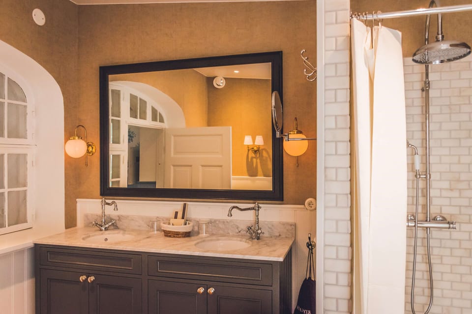 Designer toiletries, hair dryer, slippers, towels