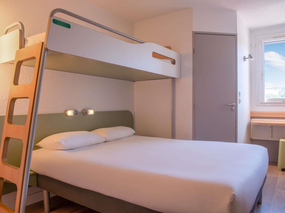 Desk, blackout drapes, WiFi (free), bed sheets