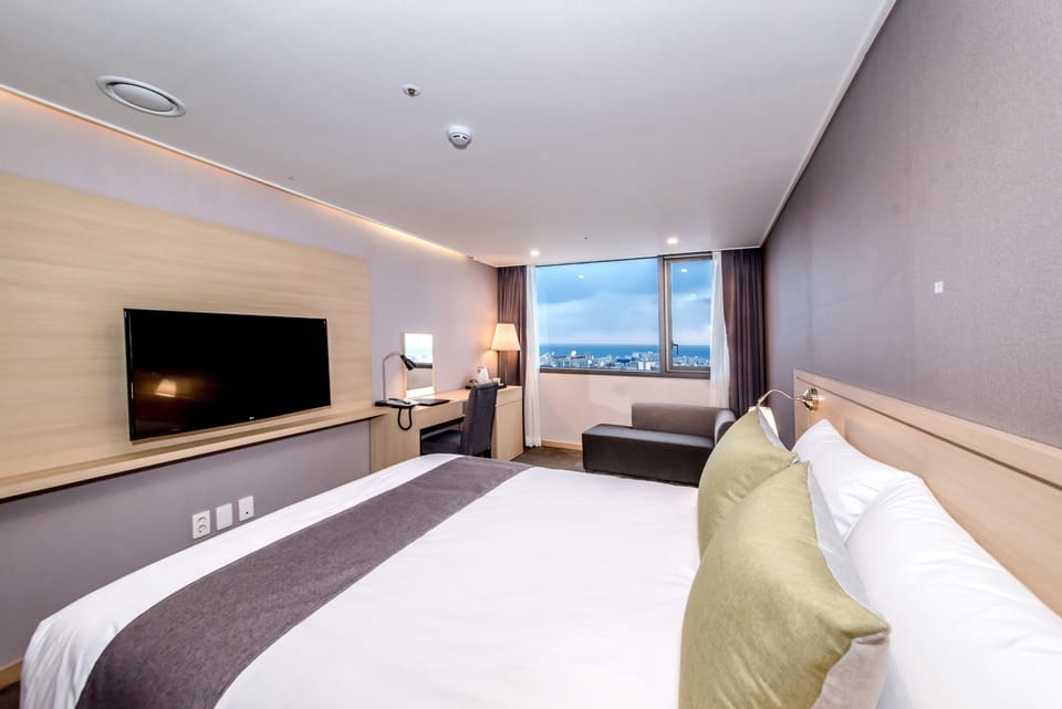 Deluxe Double Room (Mountain/Ocean View assigned on site) | Desk, blackout drapes, free WiFi