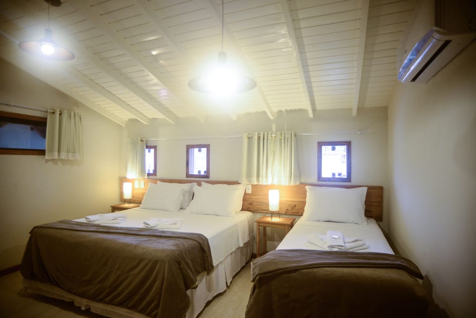 Triple Room | Minibar, blackout drapes, free WiFi, bed sheets