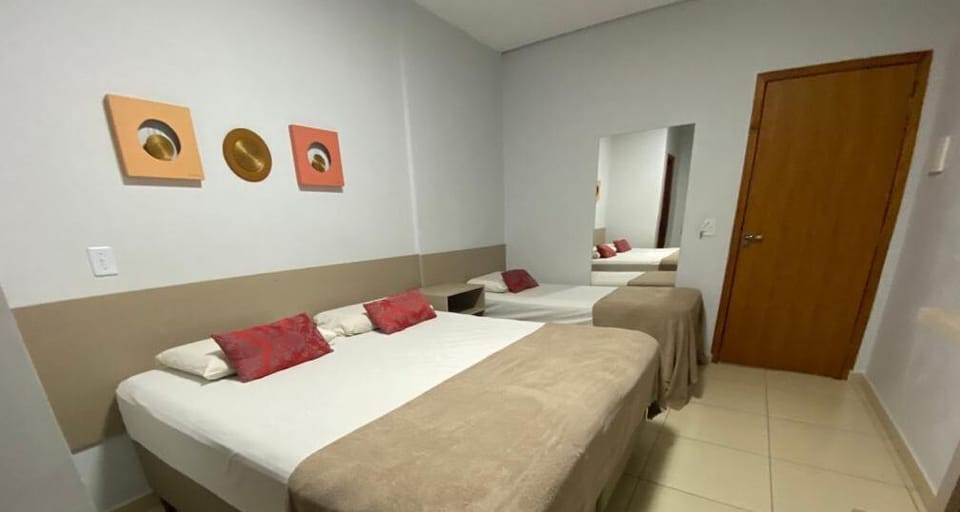 Economy Triple Room | Minibar, individually decorated, iron/ironing board, free WiFi
