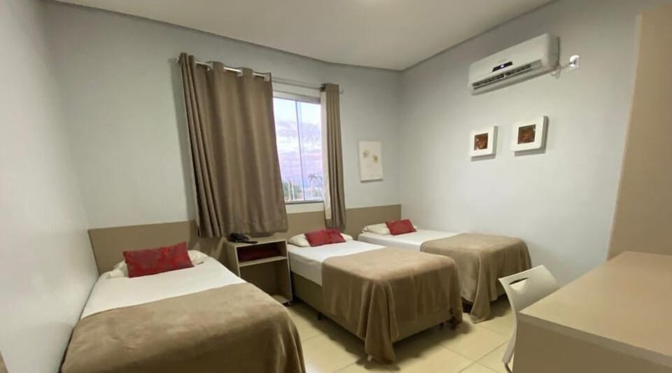 Economy Triple Room | Minibar, individually decorated, iron/ironing board, free WiFi