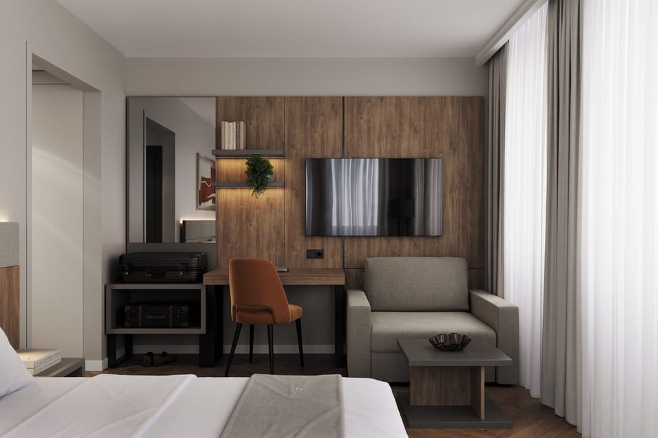 Deluxe Room | Minibar, desk, laptop workspace, blackout drapes