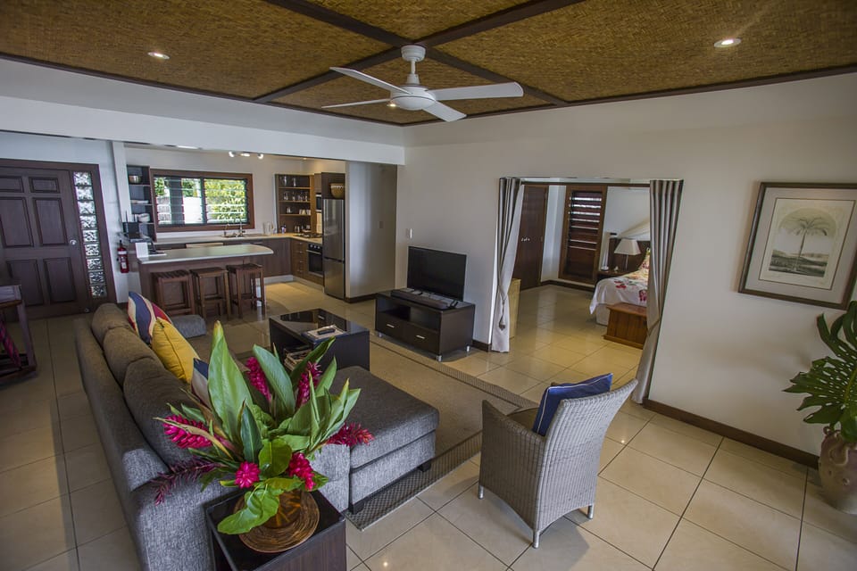 One Bedroom Villa - Beachfront | Living room | Flat-screen TV, DVD player