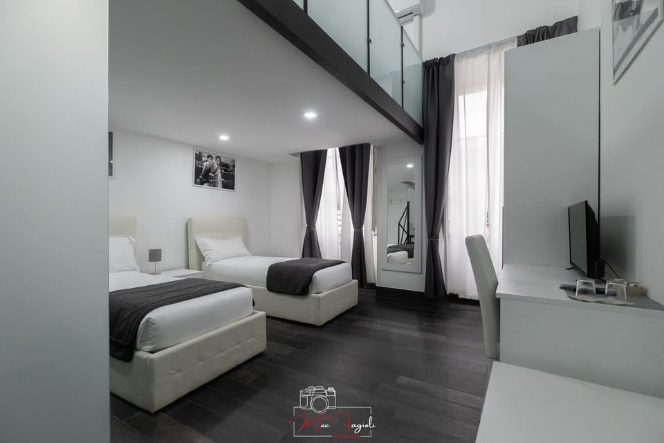 Quadruple Room | Minibar, in-room safe, desk, iron/ironing board