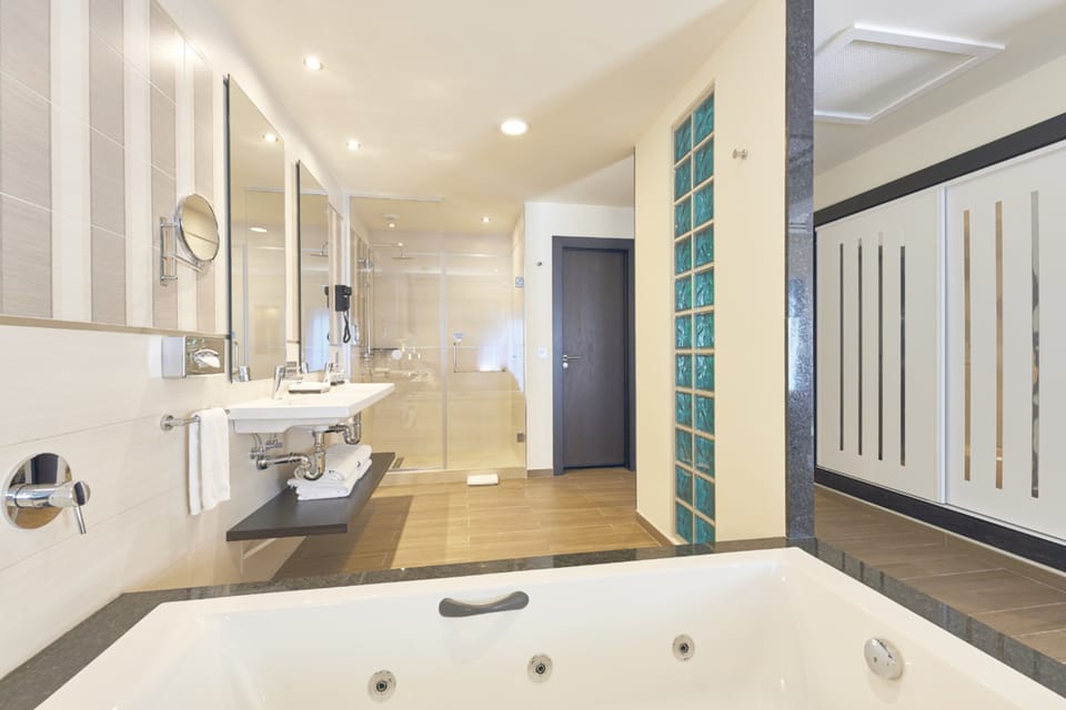 Shower, eco-friendly toiletries, hair dryer, towels